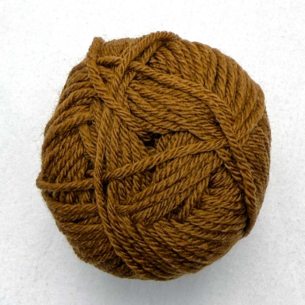 A brown orange ball of Sandnes Garn Double Sunday yarn