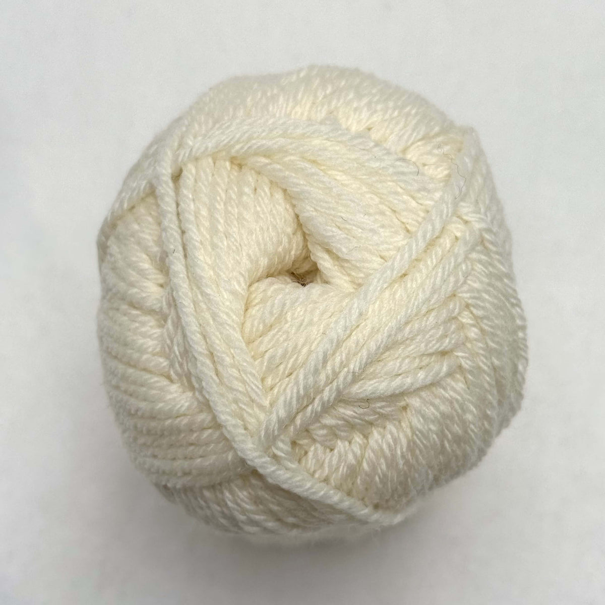 A cream white ball of Sandnes Garn Double Sunday yarn