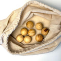 Eights cedar moth balls in a cotton drawstring bag