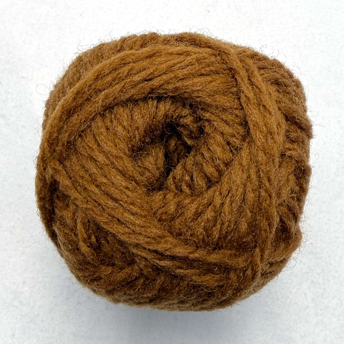 A brown orange ball of Sandnes Garn Fritidsgarn yarn