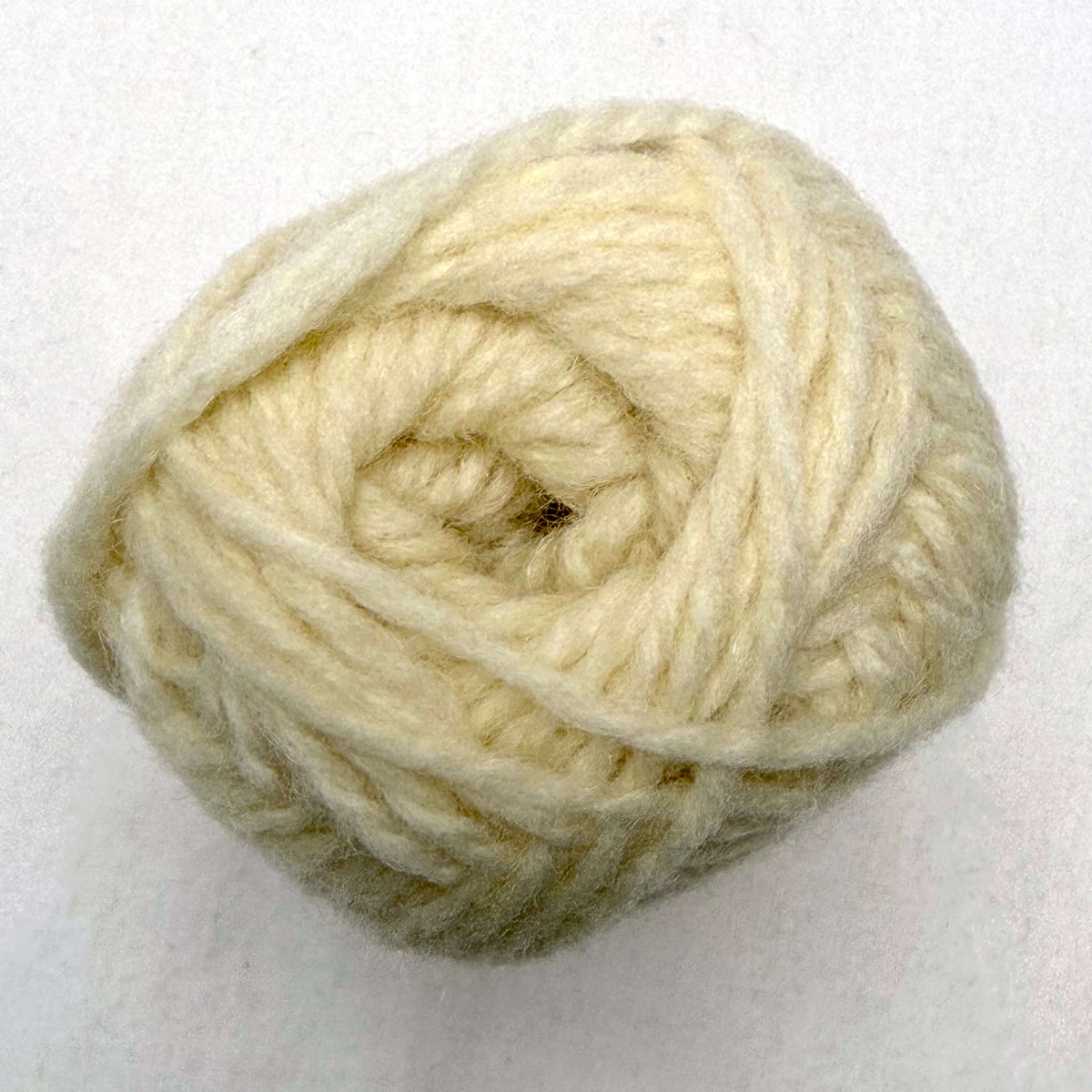 A cream ball of Sandnes Garn Fritidsgarn yarn