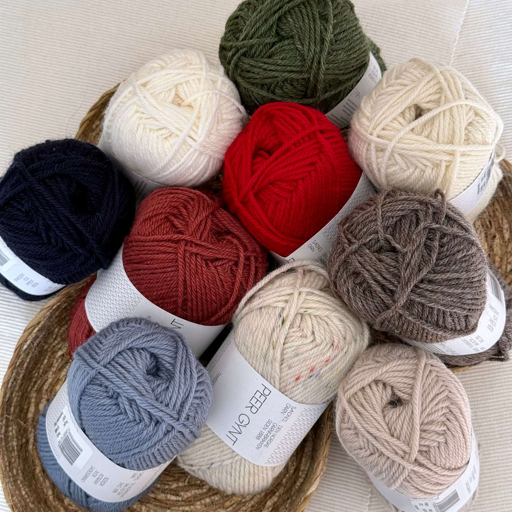 10 balls of Sandnes Garn Peery Gynt yarn in a range of colours