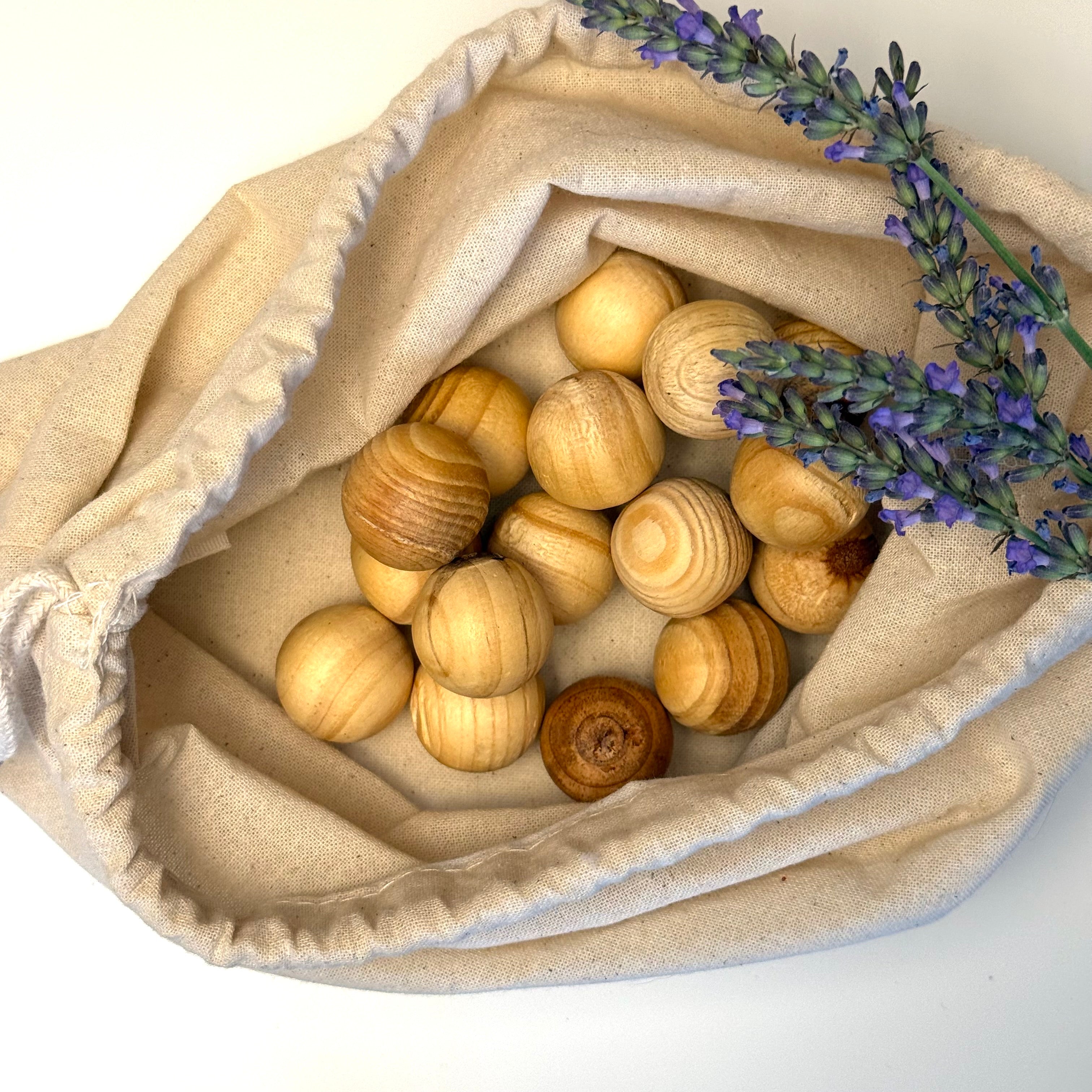 Sixteen cedar moth balls in a cotton drawstring bag with lavender
